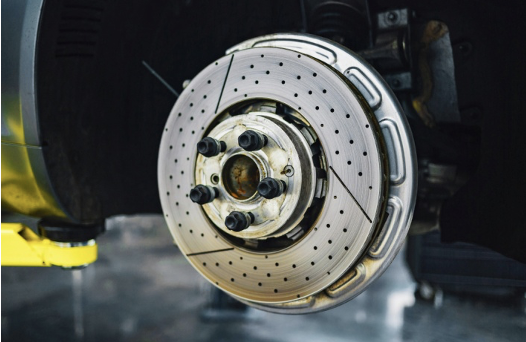 Close-up of a tire and brake pad